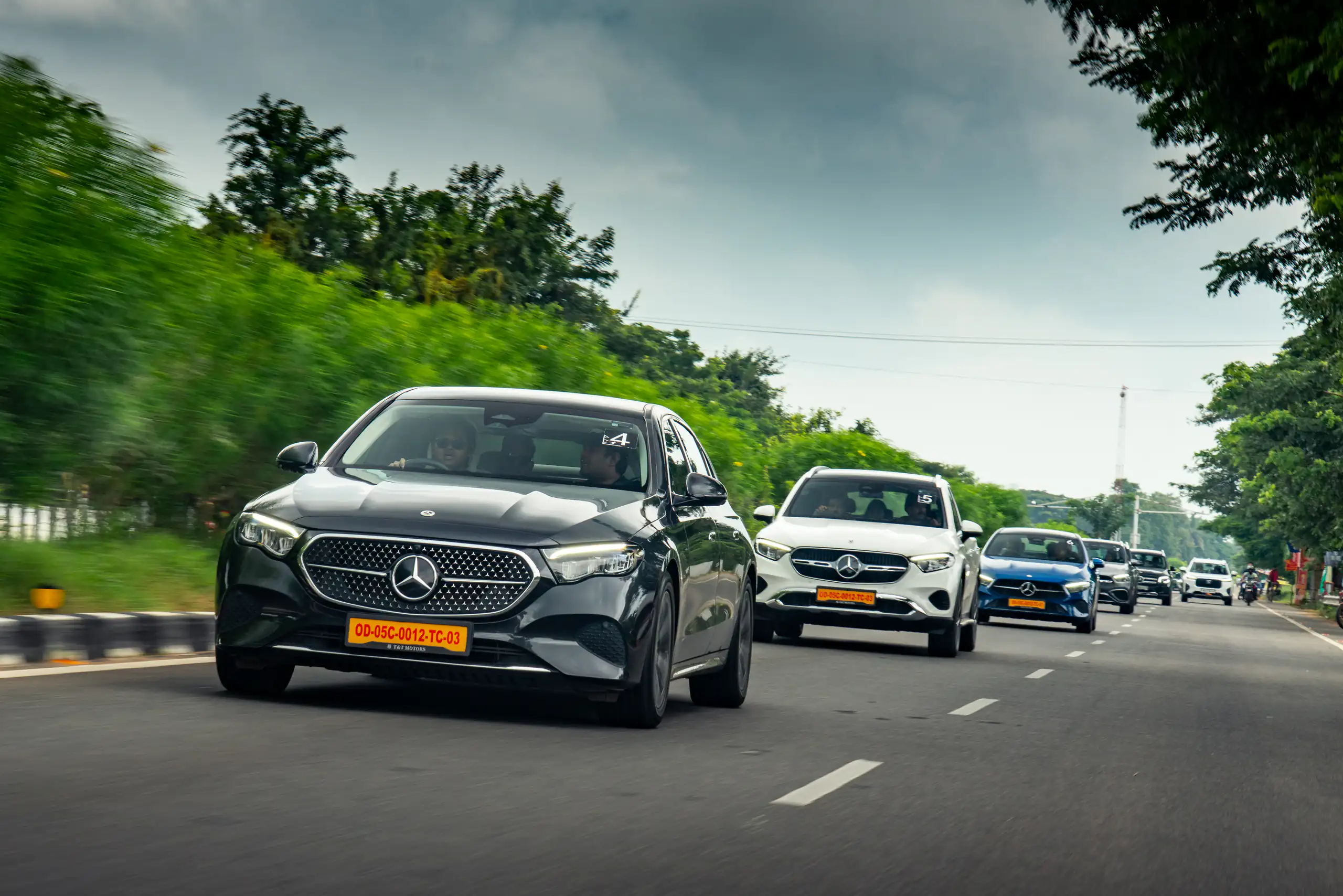 Mercedes-Benz convoy photographed in motion on a divided road