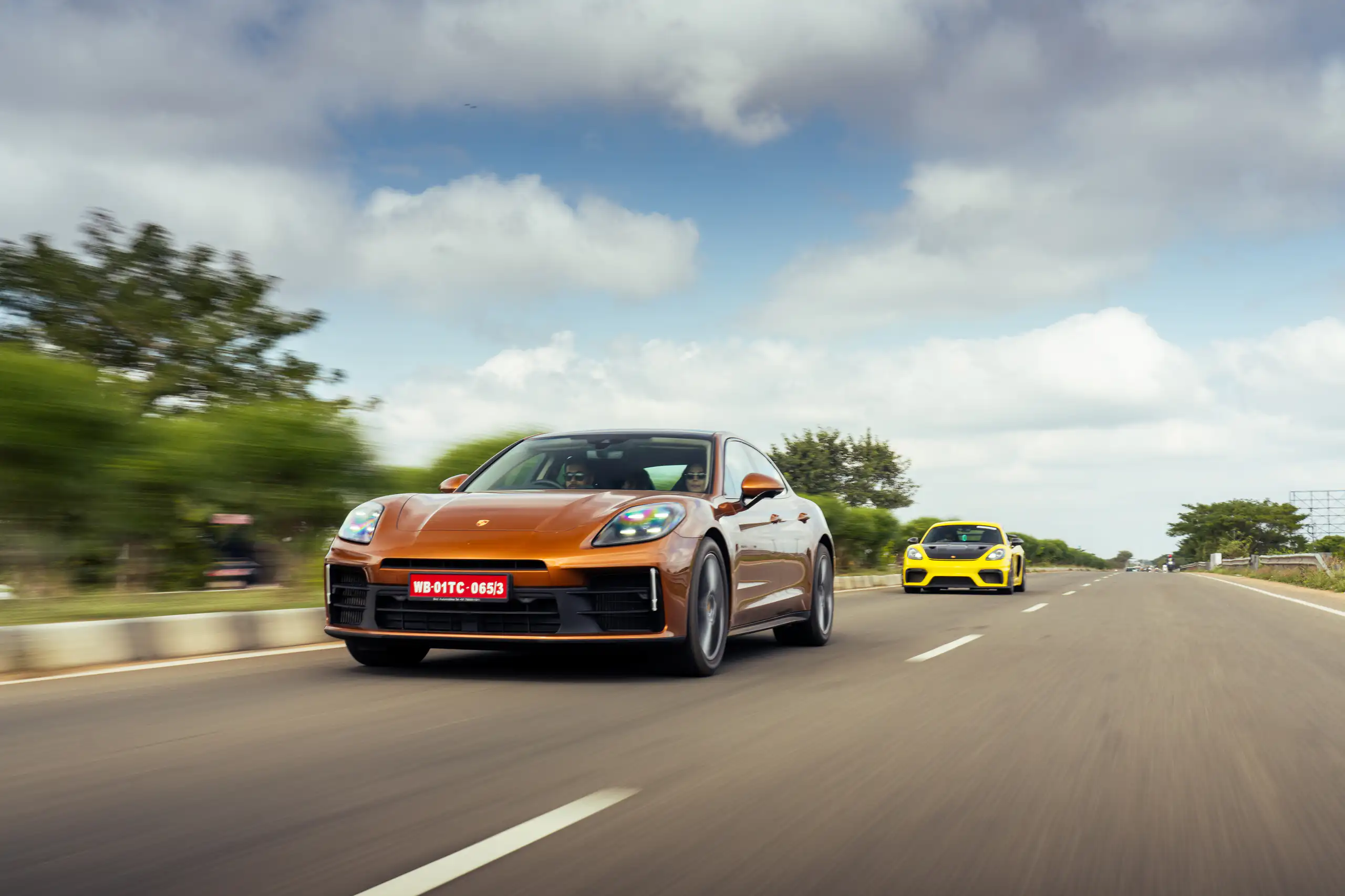 Performance car captured against streaked roadside scenery