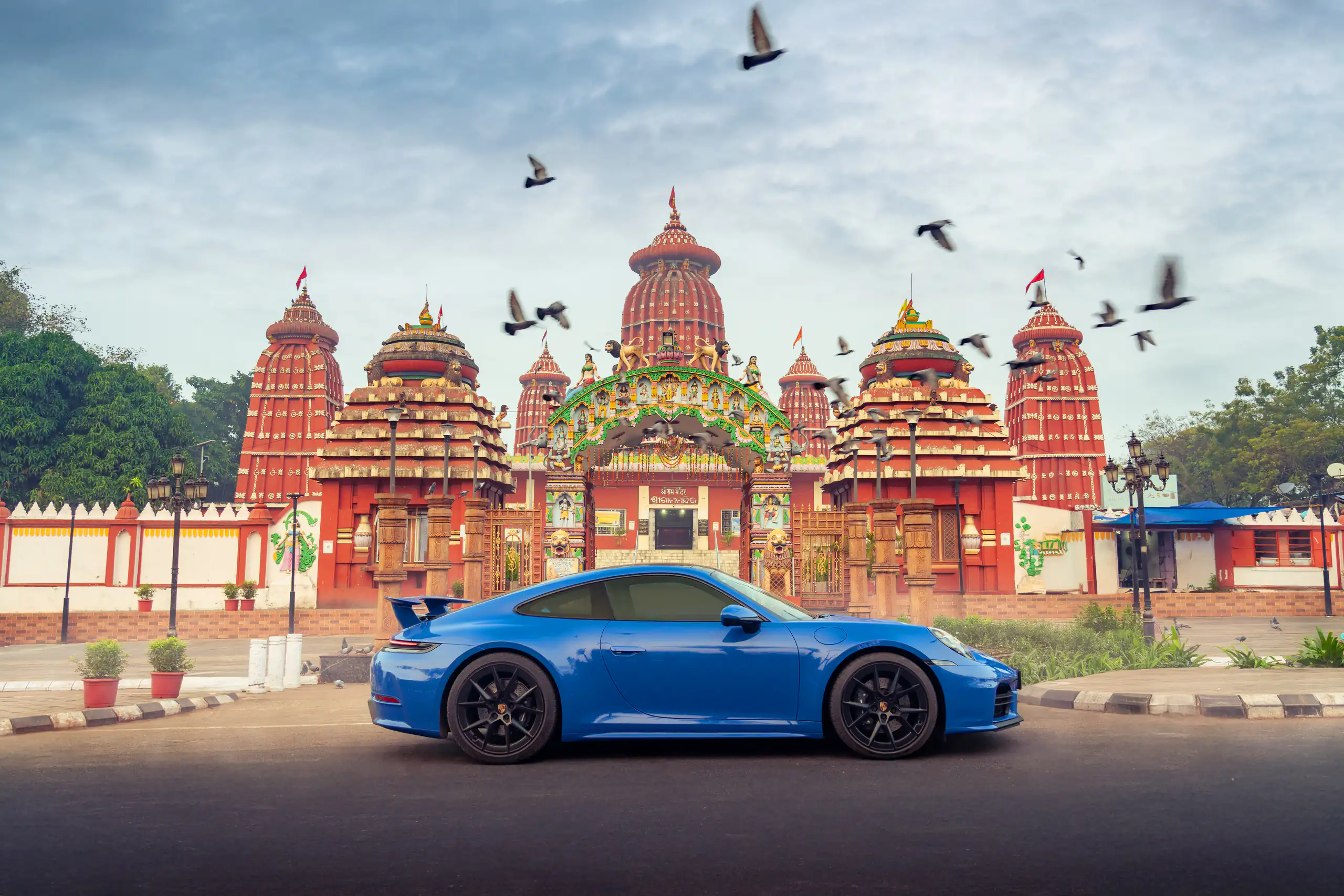 Sports car travelling through warm early morning light