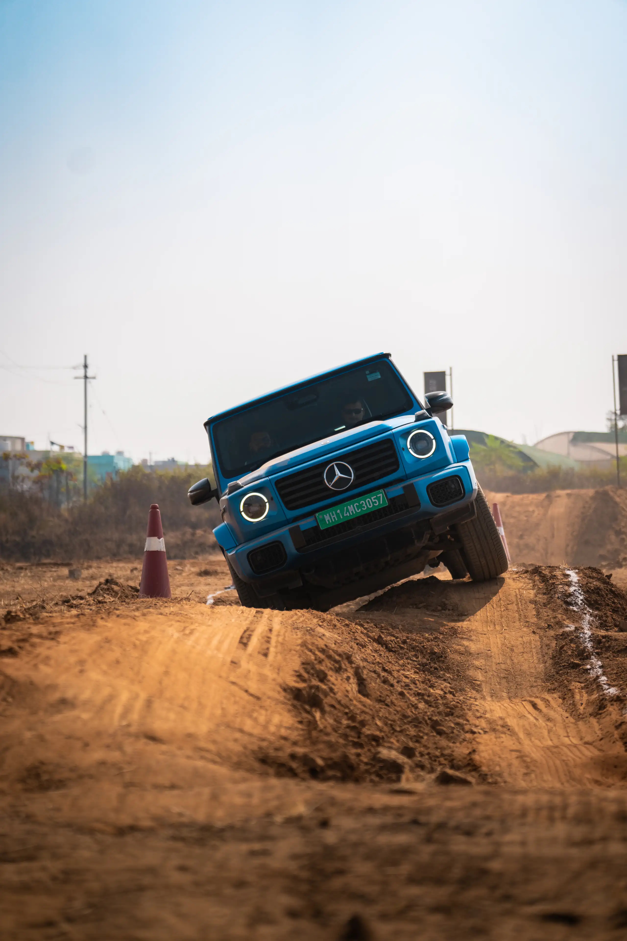 Blue Mercedes-Benz G-Class descending a rough off-road track